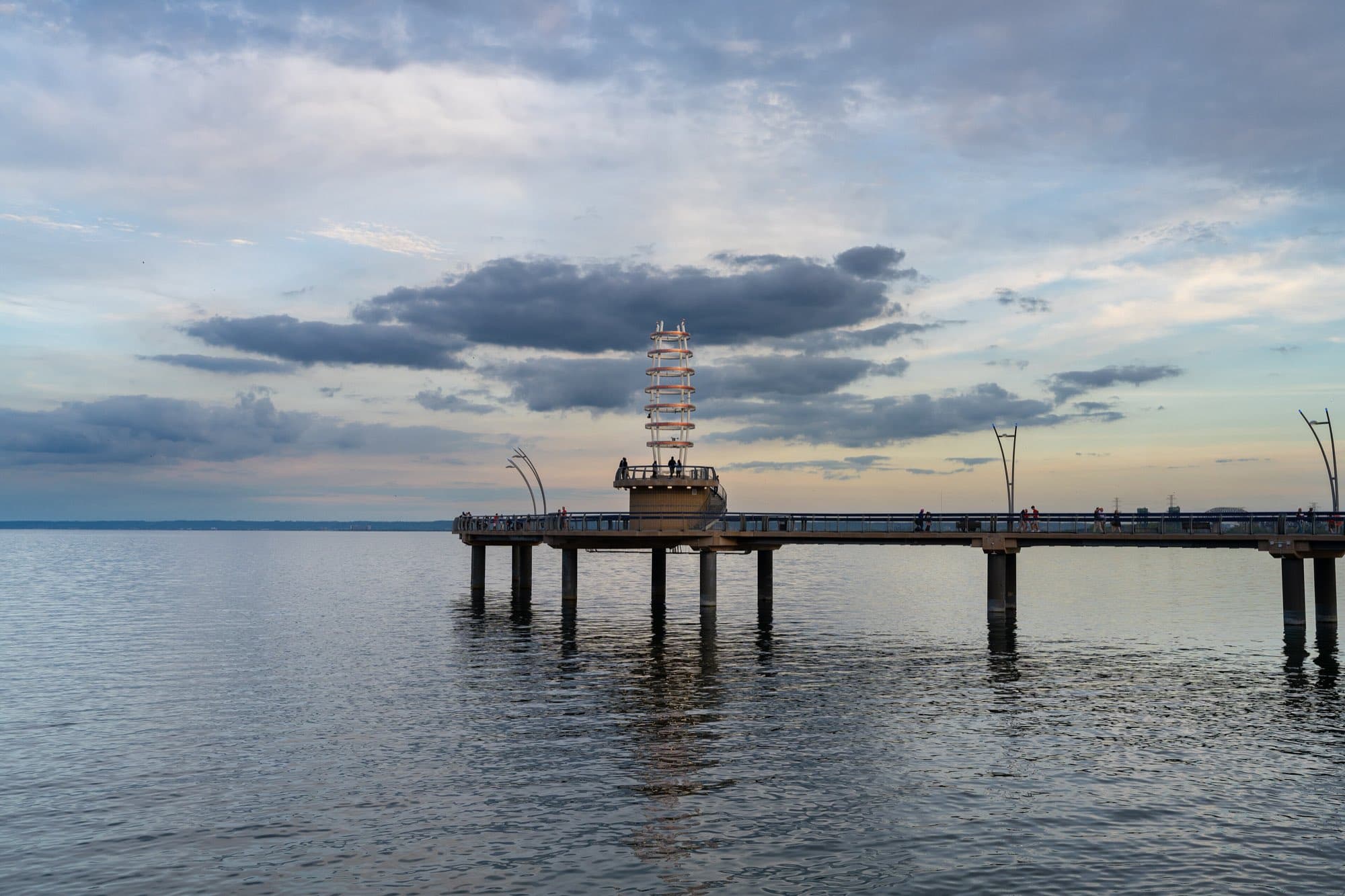 The Brant Street Pier reaching out into Lake Ontario at dusk