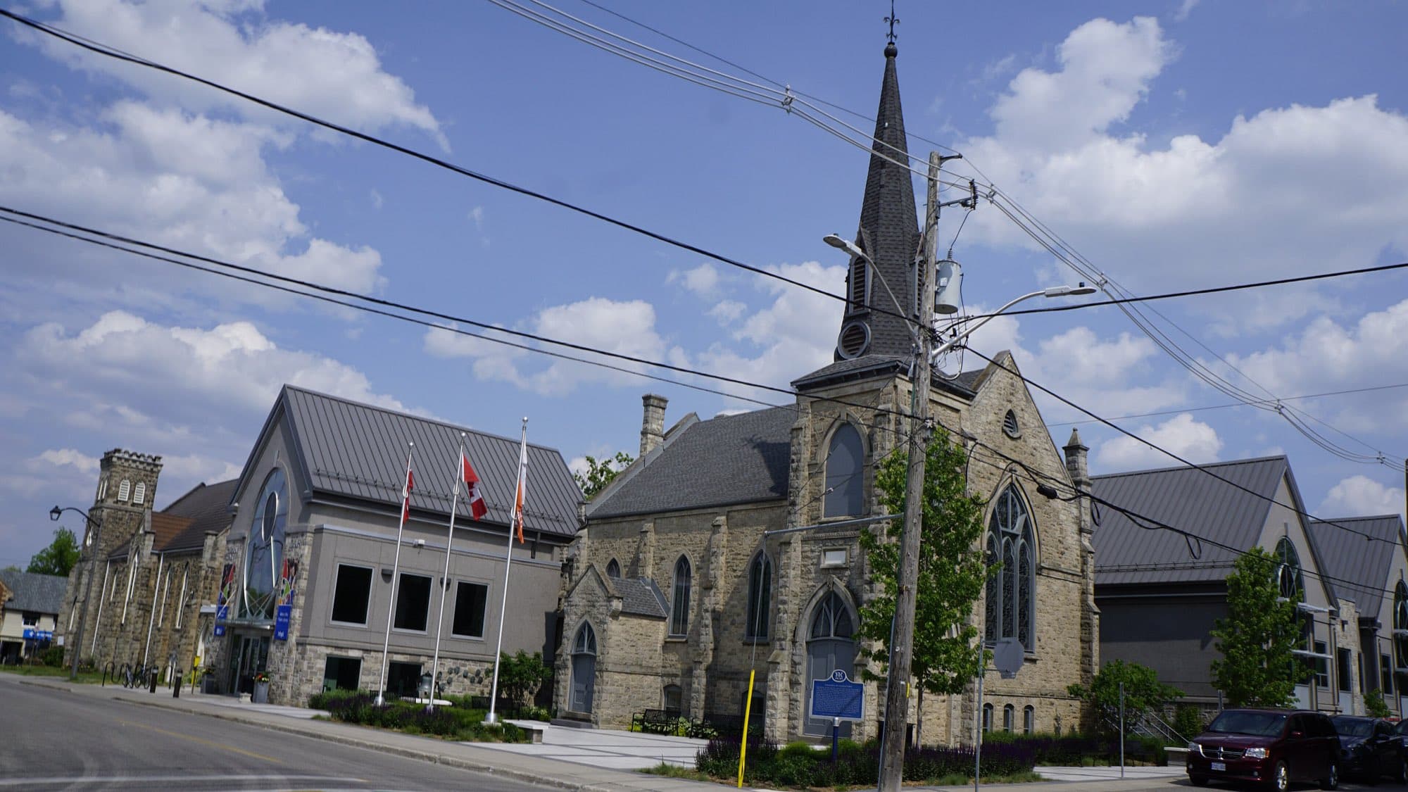 The main street in Georgetown, with the library and a church spire behind it
