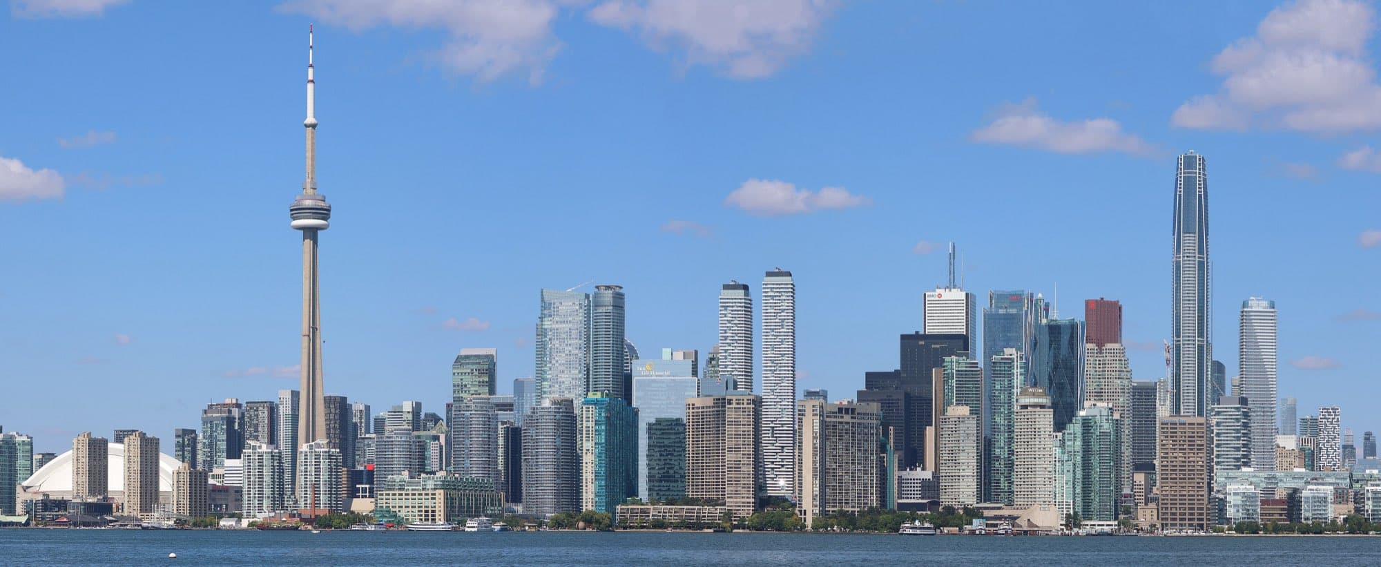The Toronto skyline across the water, the CN Tower among the downtown towers