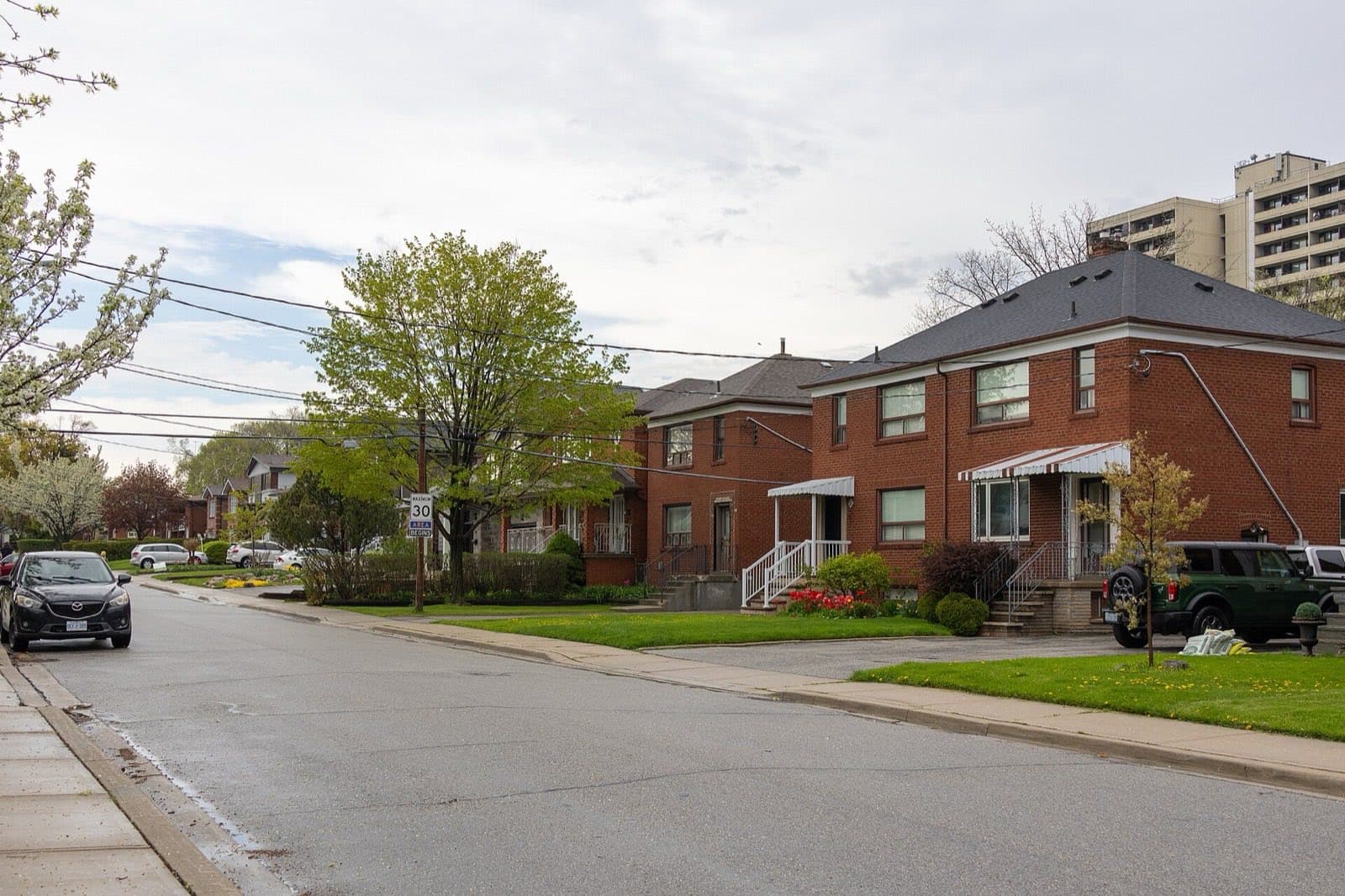 Post-war detached houses on a street with front lawns