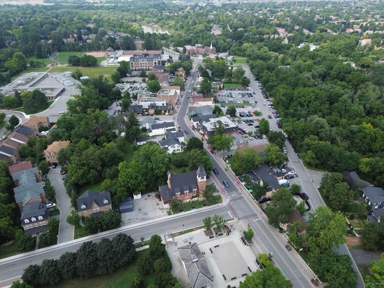Unionville's historic main street from the air, lined with trees and older buildings